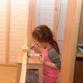 Greta Making a Computer out of wood scraps1